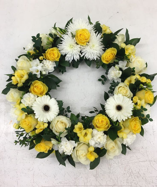 Couronne de fleurs blanches et jaunes - Livraison de fleurs à Lausanne - Florgan